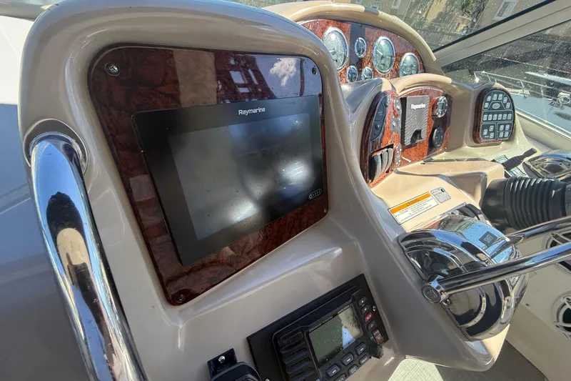 Slide: The Image of Control panel of a 2003 Sea Ray 320 Sundancer boat with Raymarine display. - 16