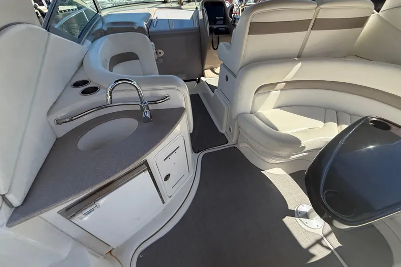 Slide: The Image of Interior of 2003 Sea Ray 320 Sundancer boat with seating and sink area. - 19