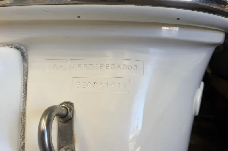 Slide: The Image of Hull identification number on 2003 Sea Ray 320 Sundancer boat, close-up view. - 26