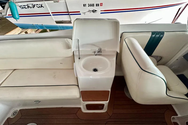 Slide: The Image of Interior of 2003 Chris-Craft Corsair 25 boat with seating and sink area. - 8