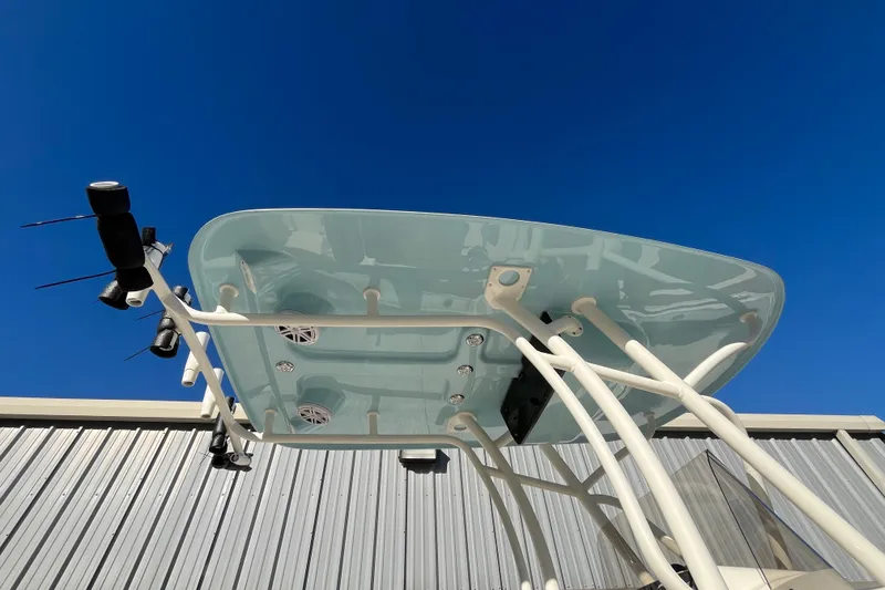 Slide: The Image of T-top of 2026 Pioneer 202 Sportfish boat against clear blue sky. - 20