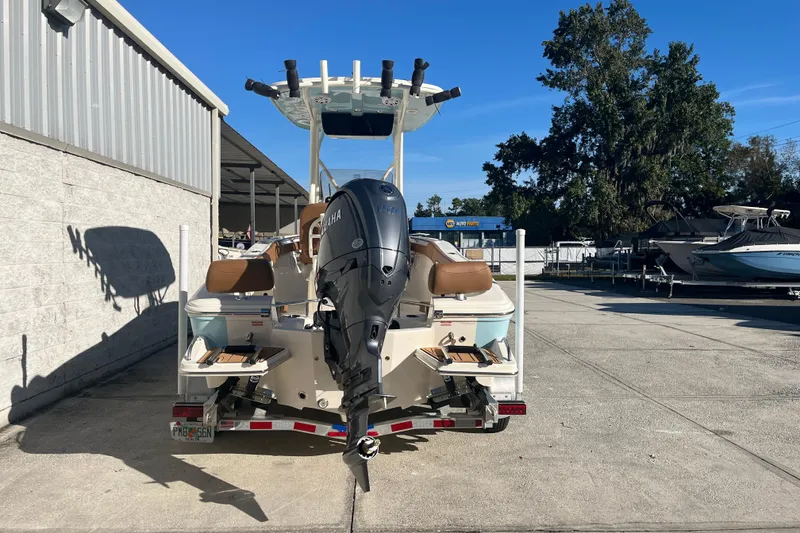 Slide: The Image of 2026 Pioneer 202 Sportfish boat with Yamaha outboard motor on a trailer. - 4