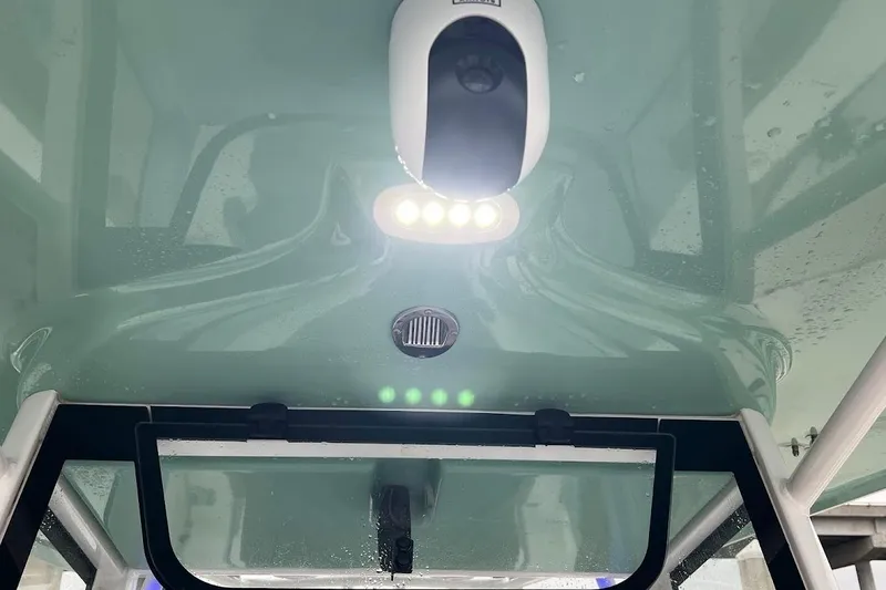 Slide: The Image of 2023 Sea Hunt Ultra 305 SE boat interior with LED lights and sleek design. - 18