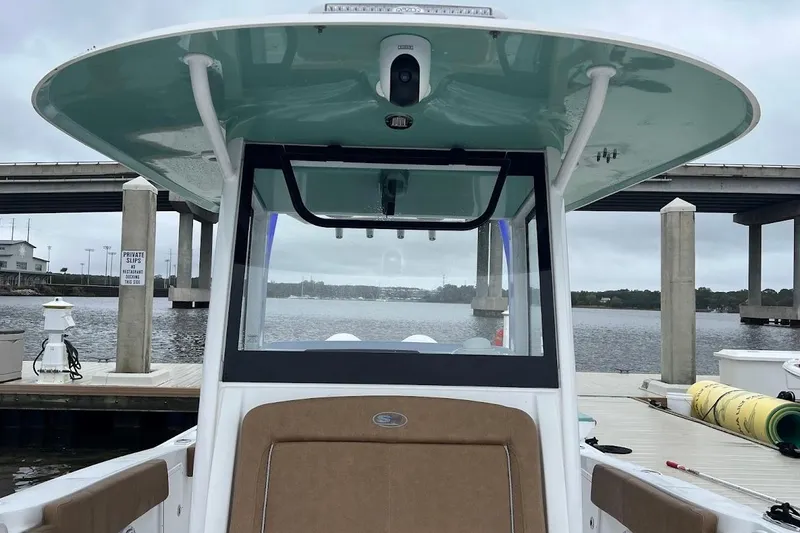 Slide: The Image of 2023 Sea Hunt Ultra 305 SE boat docked at marina, view from helm. - 19