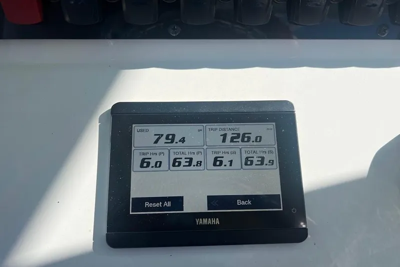 Slide: The Image of 2023 Sea Hunt Ultra 305 SE boat logo on white surface. - 5