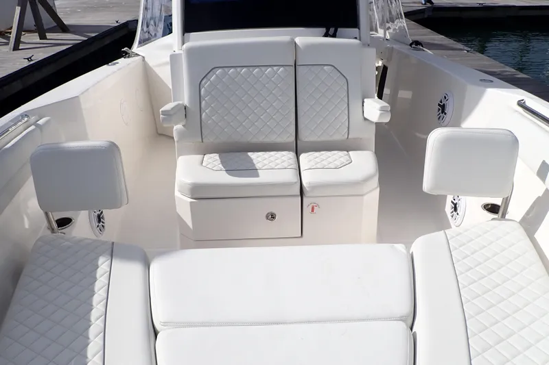 Slide: The Image of 2024 Pursuit S 288 Sport boat interior with white quilted seating. - 12