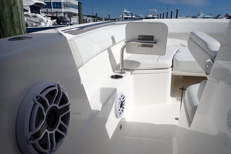 Slide: The Image of 2024 Pursuit S 288 Sport boat interior with seating and speaker system. - 20