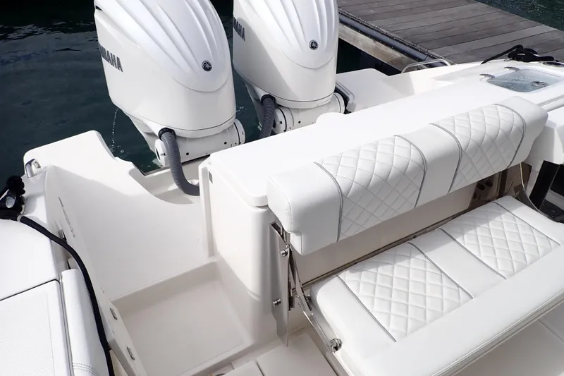 Slide: The Image of 2024 Pursuit S 288 Sport boat with dual Yamaha engines and quilted seating. - 23