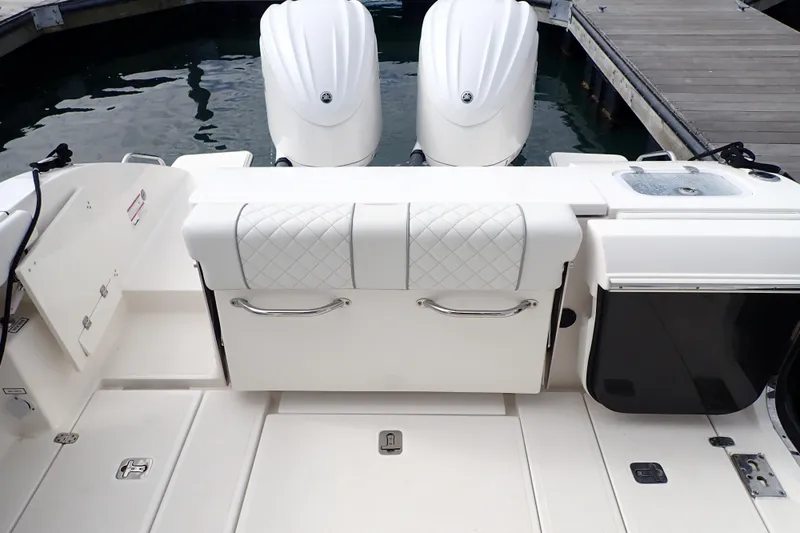 Slide: The Image of 2024 Pursuit S 288 Sport boat with dual engines and sleek deck design. - 24
