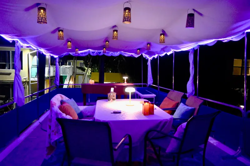 Slide: The Image of 1996 Catamaran Cruisers Aqua Cruiser 44 with cozy, illuminated deck and seating area. - 10