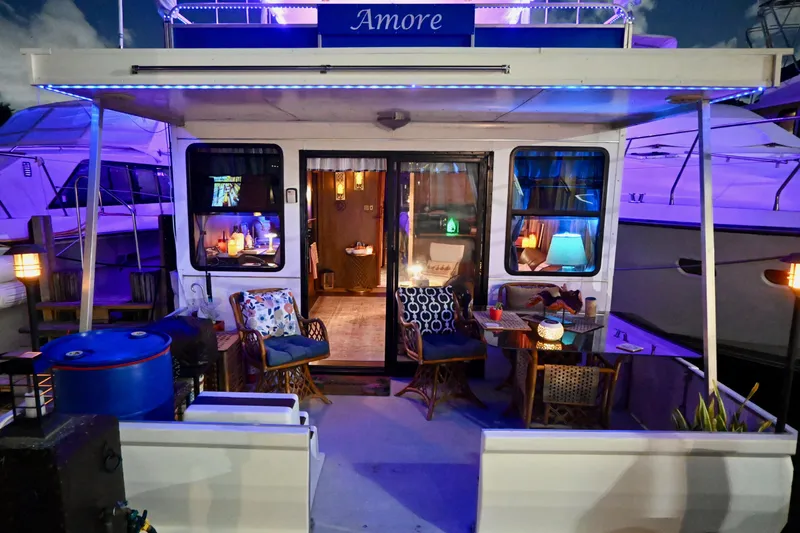 Slide: The Image of 1996 Catamaran Cruisers Aqua Cruiser 44 with cozy, illuminated deck and seating area. - 11