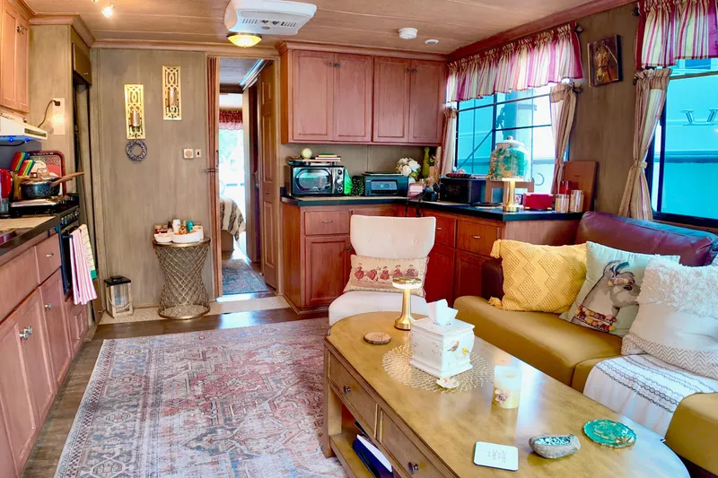 Slide: The Image of Cozy interior of 1996 Catamaran Cruisers Aqua Cruiser 44 with warm decor and comfortable seating. - 13