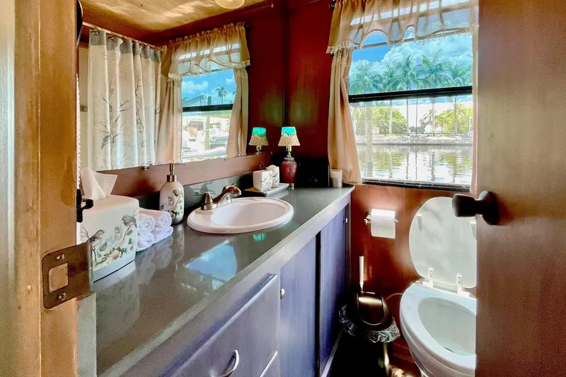 Slide: The Image of Bathroom interior of 1996 Catamaran Cruisers Aqua Cruiser 44 with lake view. - 19