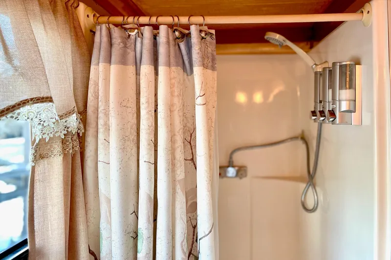 Slide: The Image of Shower area in 1996 Catamaran Cruisers Aqua Cruiser 44 with curtain and dispensers. - 20