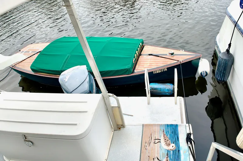 Slide: The Image of 1996 Catamaran Cruisers Aqua Cruiser 44 docked with green-covered boat nearby. - 25