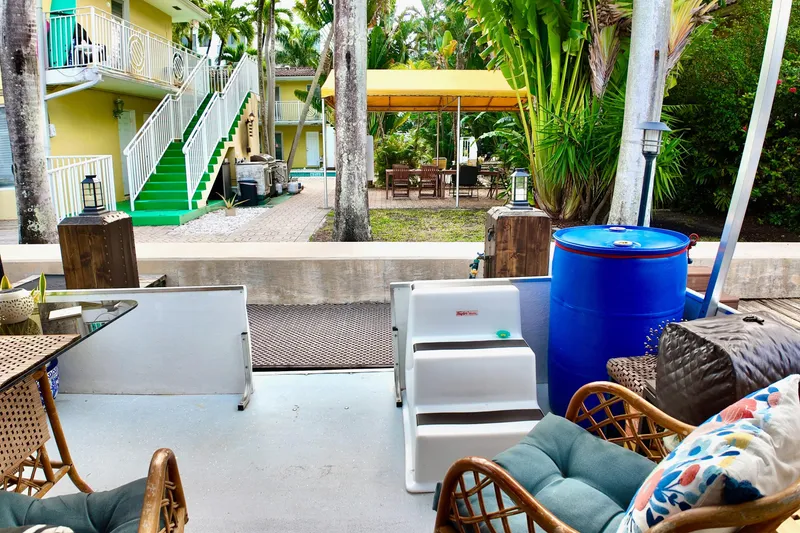 Slide: The Image of Outdoor seating area on a 1996 Catamaran Cruisers Aqua Cruiser 44, with garden view. - 27