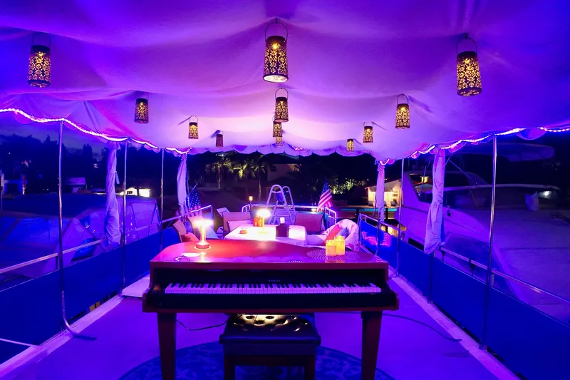 Slide: The Image of Luxurious 1996 Catamaran Cruisers Aqua Cruiser 44 with elegant piano and ambient lighting. - 4