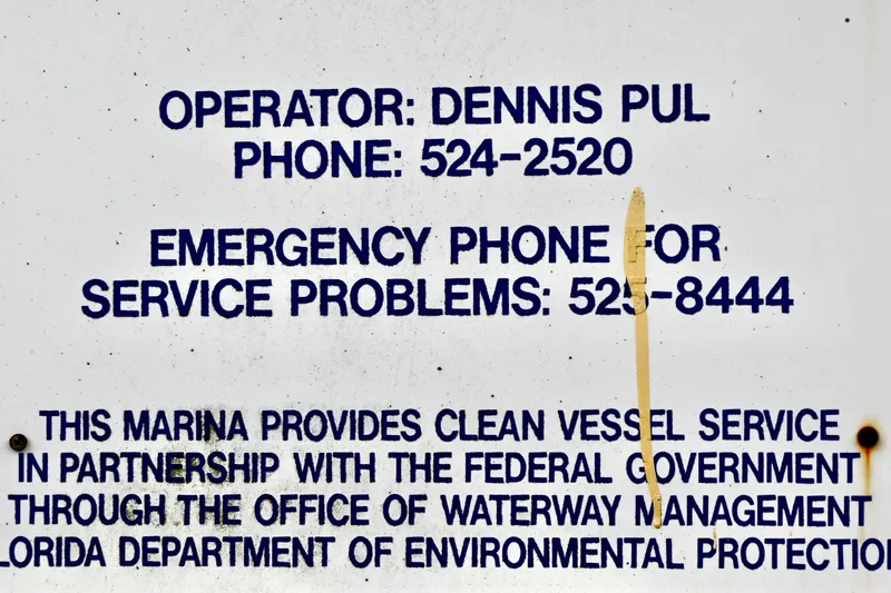 Slide: The Image of Sign with contact information for marina services and emergency assistance, promoting clean vessel service. - 40