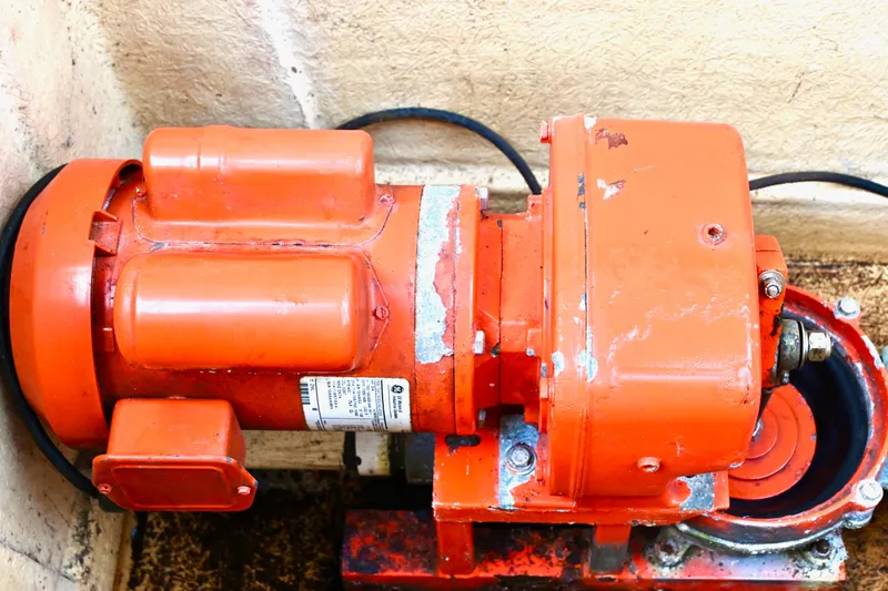 Slide: The Image of Orange motor component on 1996 Catamaran Cruisers Aqua Cruiser 44 boat. - 41