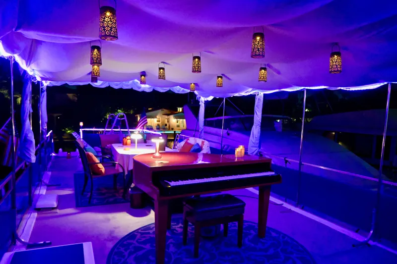 Slide: The Image of Luxurious 1996 Catamaran Cruisers Aqua Cruiser 44 with elegant lighting and piano on deck. - 7