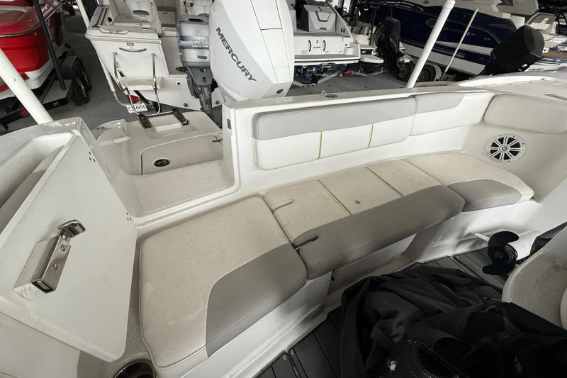 Slide: The Image of 2019 Tahoe 2150 CC boat interior with seating and Mercury outboard motor. - 10