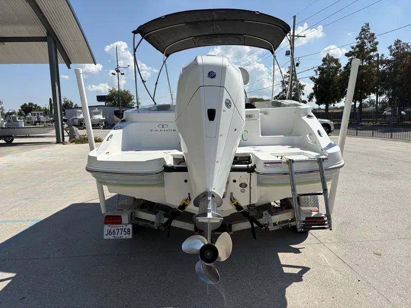 Slide: The Image of 2019 Tahoe 2150 CC boat interior with spacious seating and modern design. - 6