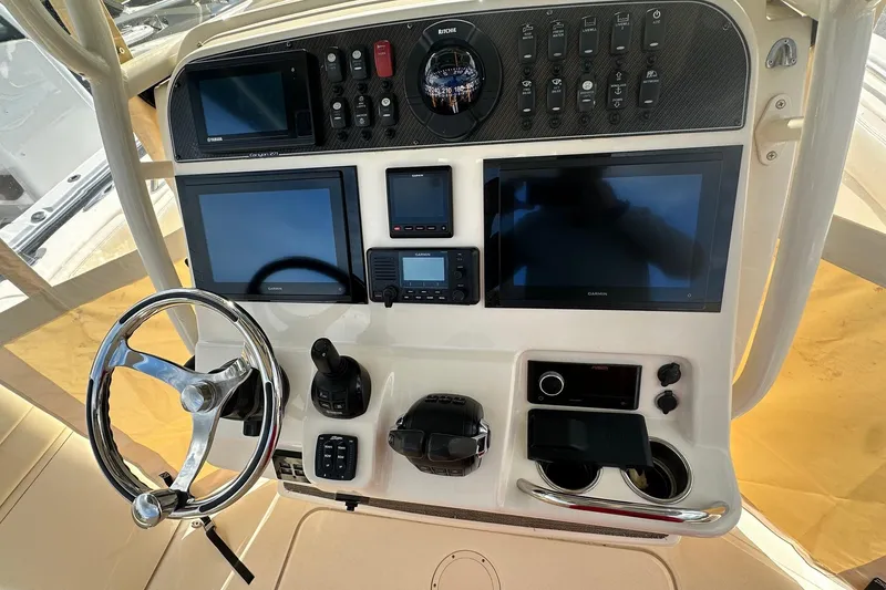 Slide: The Image of 2020 Grady-White Canyon 271 helm with advanced navigation and control systems. - 15