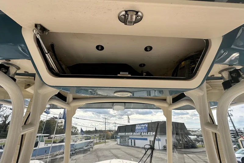 Slide: The Image of 2020 Grady-White Canyon 271 boat interior with open storage compartment. - 17