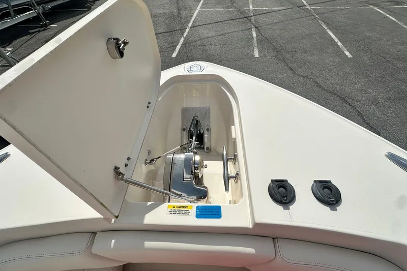 Slide: The Image of 2020 Grady-White Canyon 271 boat anchor compartment with open hatch. - 27
