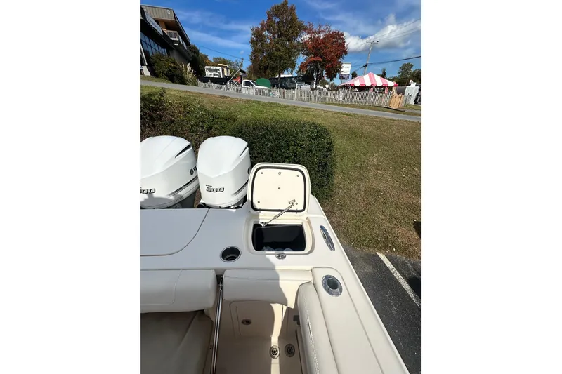 Slide: The Image of 2020 Grady-White Canyon 271 boat with open storage compartment and dual engines. - 4