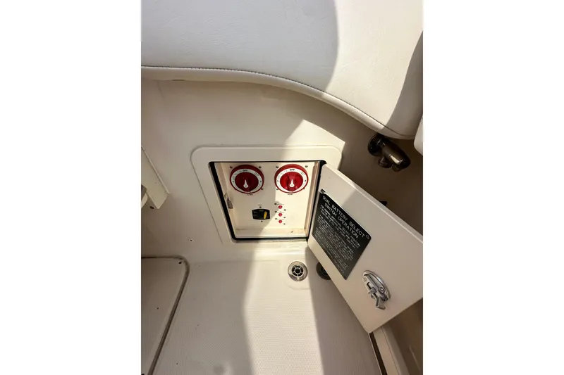 Slide: The Image of 2020 Grady-White Canyon 271 boat battery control panel with dual selector switches. - 6