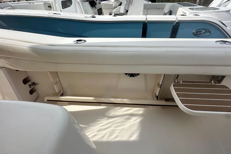 Slide: The Image of 2020 Grady-White Canyon 271 boat interior with seating and storage features. - 8