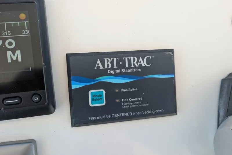 Slide: The Image of ABT-TRAC digital stabilizers panel on 2015 American Tug 435 boat dashboard. - 20