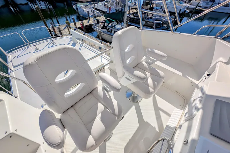Slide: The Image of Luxury seating on 2015 American Tug 435 yacht, docked at marina. - 25