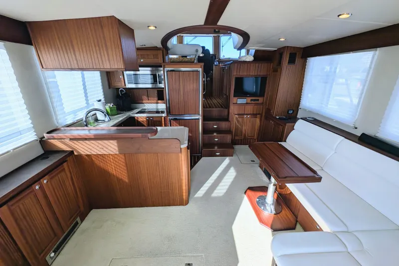 Slide: The Image of Luxurious interior of 2015 American Tug 435 with modern kitchen and comfortable seating. - 28