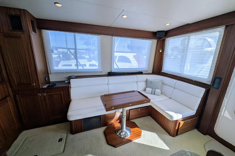 Slide: The Image of Luxurious interior of 2015 American Tug 435 with white seating and wooden accents. - 29