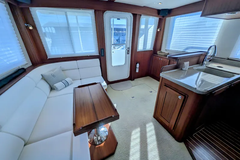 Slide: The Image of Luxurious interior of 2015 American Tug 435 with elegant seating and modern kitchen amenities. - 32
