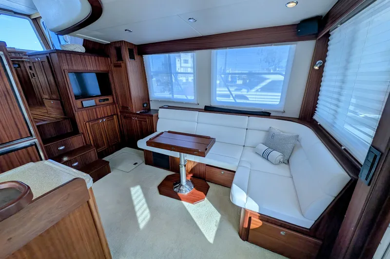 Slide: The Image of Luxurious interior of 2015 American Tug 435 with plush seating and elegant wood finishes. - 33