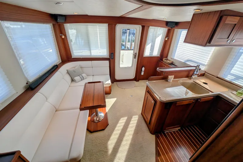Slide: The Image of Luxurious interior of 2015 American Tug 435 with elegant seating and modern kitchen area. - 34