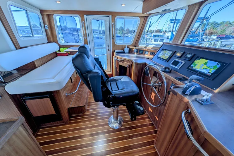 Slide: The Image of Pilothouse of 2015 American Tug 435 with navigation equipment and captain's chair. - 43