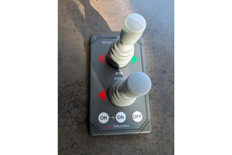 Slide: The Image of Joystick controls for bow and stern thrusters on a 2015 American Tug 435. - 46