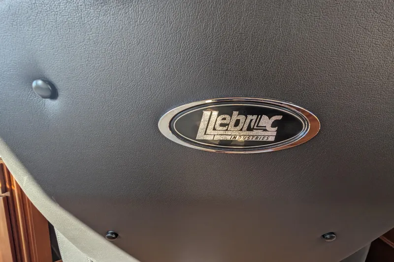 Slide: The Image of Leather seat with Lebroc Industries logo on a 2015 American Tug 435. - 55