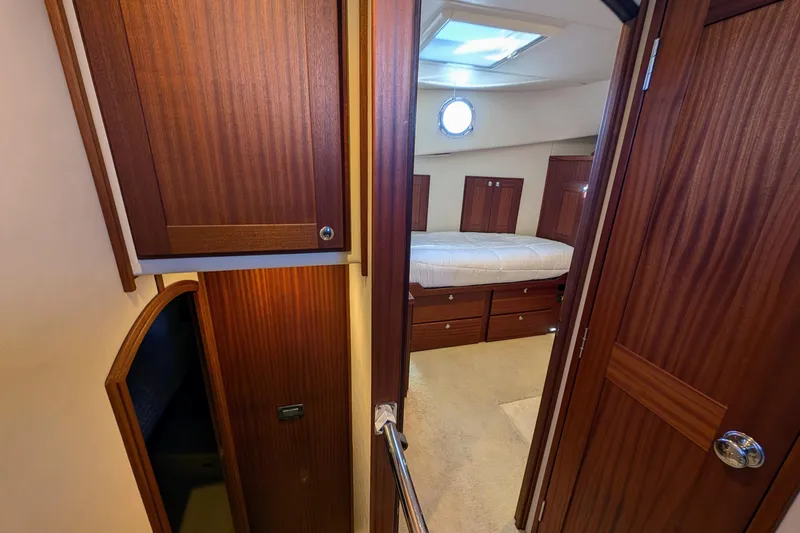 Slide: The Image of Interior cabin of 2015 American Tug 435 with wood paneling and bed. - 57