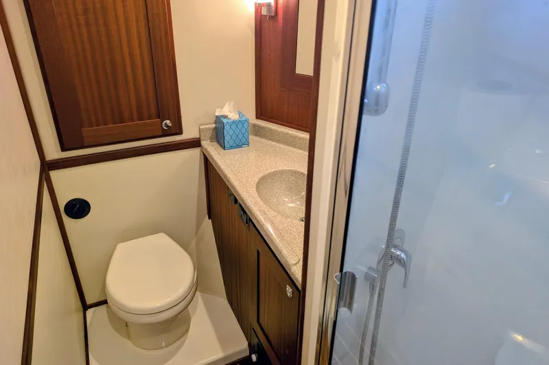 Slide: The Image of Bathroom interior of 2015 American Tug 435 with shower, toilet, and sink. - 62