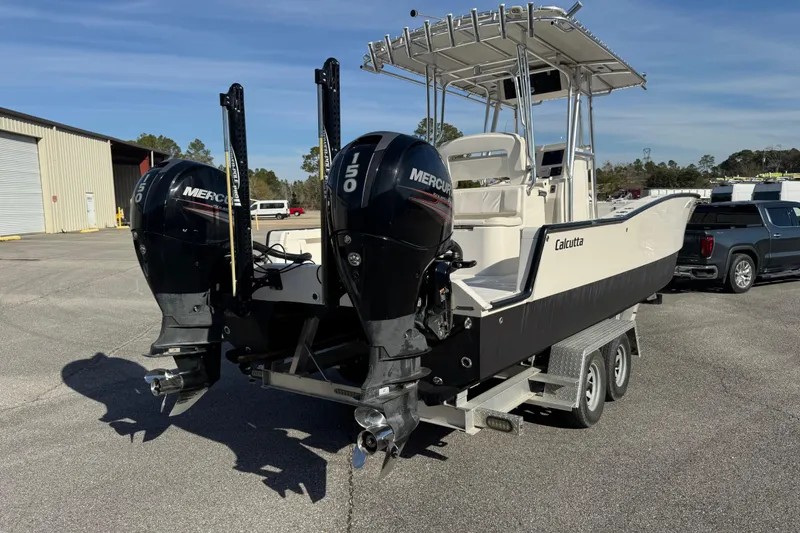 Slide: The Image of 2018 Calcutta catamaran with dual Mercury 150 engines on a trailer. - 1