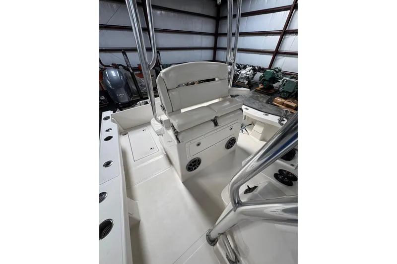 Slide: The Image of 2018 Calcutta catamaran interior with seating and storage in a warehouse setting. - 14