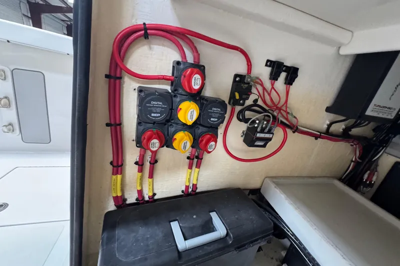 Slide: The Image of Electrical panel of a 2018 Calcutta catamaran with wiring and switches. - 15