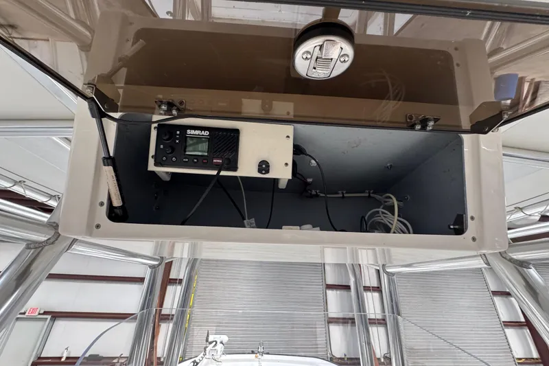 Slide: The Image of 2018 Calcutta catamaran electronics compartment with Simrad marine equipment. - 16