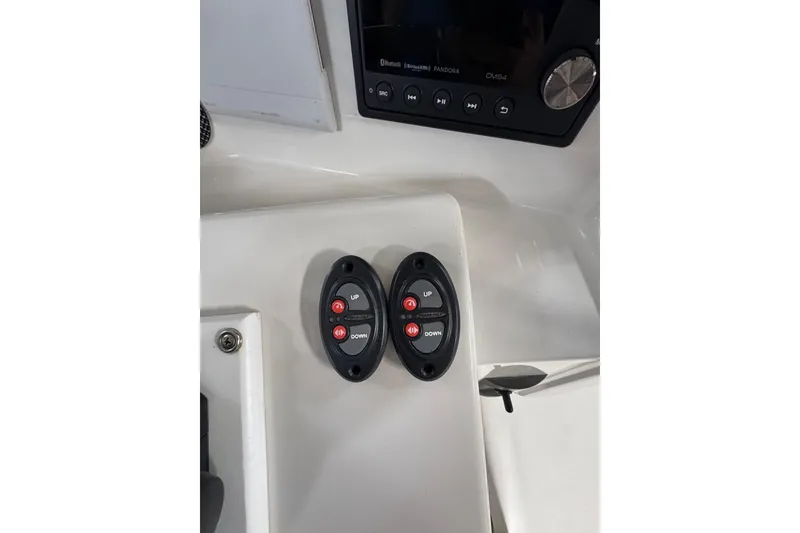 Slide: The Image of Control panel of a 2018 Calcutta catamaran with up and down buttons. - 17