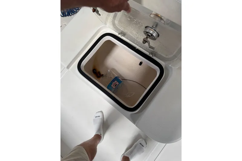 Slide: The Image of Open storage compartment on 2018 Calcutta catamaran boat deck. - 19